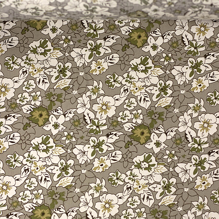 Tecido tricoline fio 40 em tom bege com estampa floral em tons neutros. Tecido tricoline fio 40 em tom bege com estampa floral em tons neutros.